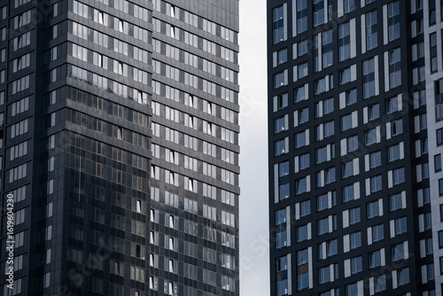 Wallpaper Mural empty glass windows of a modern building with a reflection of the sky in the glass Torontodigital.ca