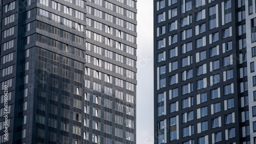 Wallpaper Mural empty glass windows of a modern building with a reflection of the sky in the glass Torontodigital.ca