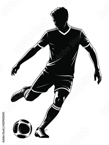 Silhouette of a soccer player kicking a ball