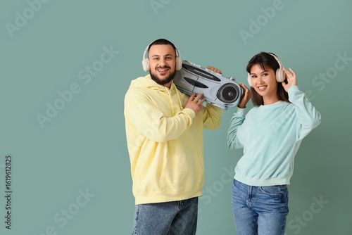 Young couple in headphones ...