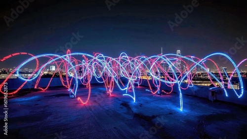 LED Light Painting. Long exposure blue red light trails abstract waves