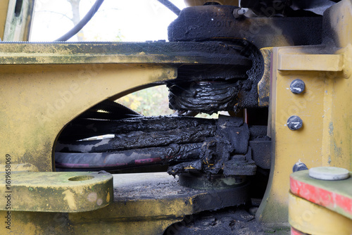 Worn Industrial Machine Part with Grease and Grime