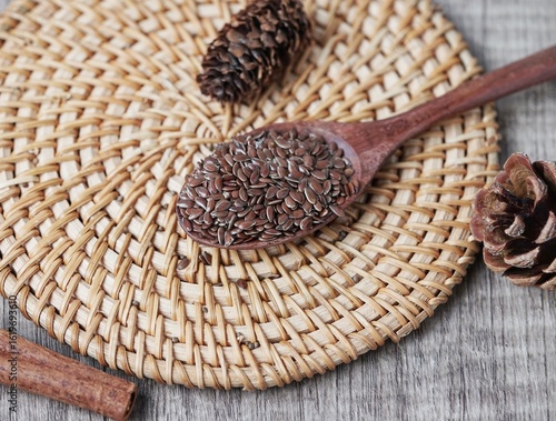 Close up of flaxseed on wooden spoon. Healthy food.