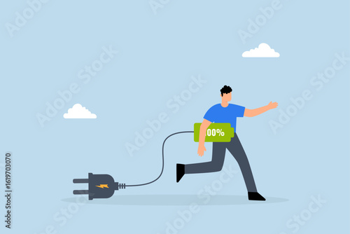 Full recharge energized, driven entrepreneur holds a fully charged battery prepared to strive for achievement.