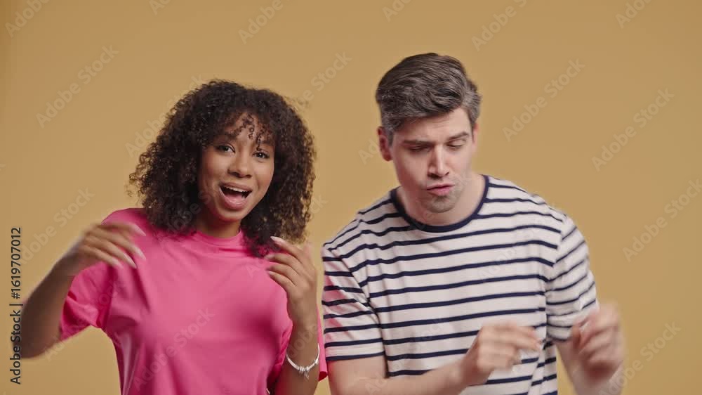 Positive American Interracial Couple Dancing. Beige Wall. Music, Dance, Party Positive American Interracial Couple Dancing. Beige Wall. Music, Dance, Party