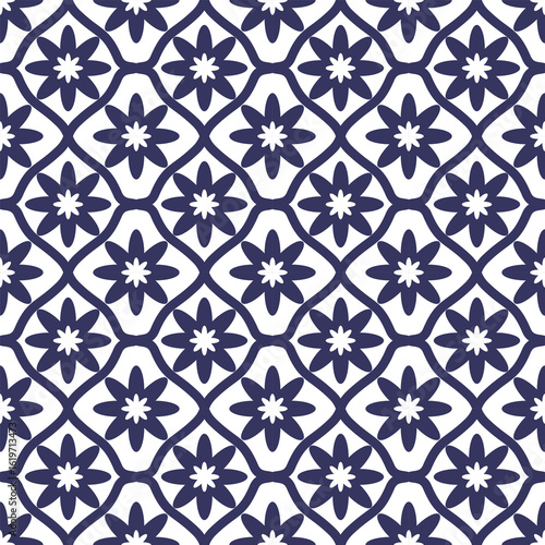 Seamless pattern of dark blue floral elements connected by curved lines on white background abstract