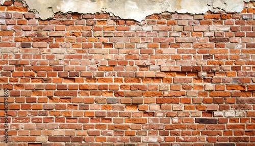 Aged brick wall with crumbling plaster