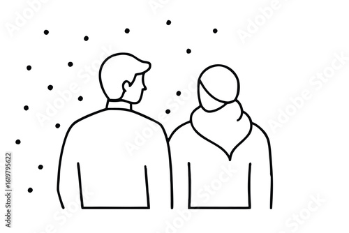 Couple standing together looking out at falling snowflakes