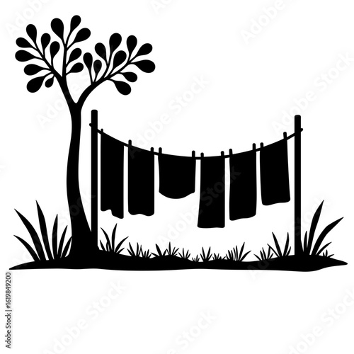 Silhouette of clothesline with towels drying outside – Eco-friendly practice, energy saving