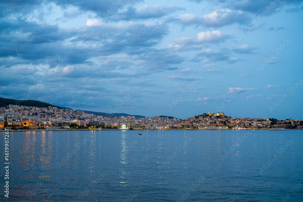 Fototapeta premium Coastal Town of Kavala at Twilight with Reflections on Water