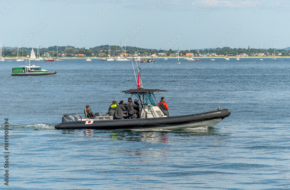 Fototapeta premium Aarhus, Denmark – August 19, 2021: Sailgp racing in the harbor of Aarhus in Denmark