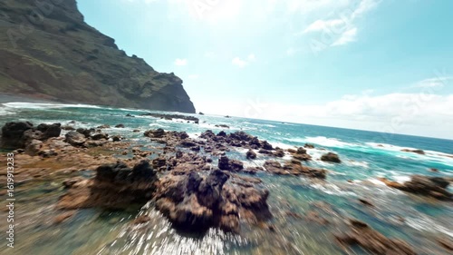 FPV drone over rocky La Palma coast with turquoise sea views