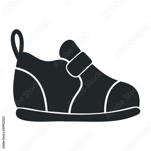 Black and white silhouette of a baby shoe with velcro strap. Vector illustration