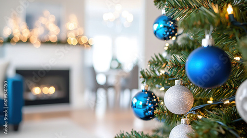 Beautiful Christmas tree decorated with blue and silver ornaments, creating festive atmosphere in cozy living room