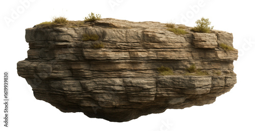 Steep riverbank with stratified rock layers and sparse vegetation