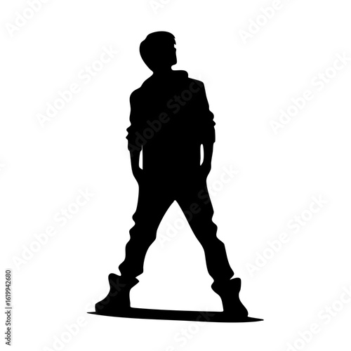 Young man standing confidently with hands in pockets silhouette  