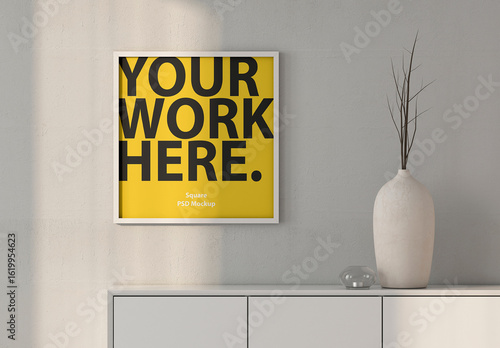 Square poster Art Frame Mockup hanging on wall