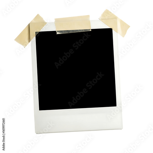 Empty polaroid frame taped to a black background offers creative template for personal memories and digital designs providing vintage aesthetic