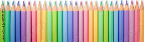 Seamless row of pastel colored pencils banner. Row of sharpened colored pencils in a soft pastel palette. Creative background or border for educational, artistic, or design-related content.
