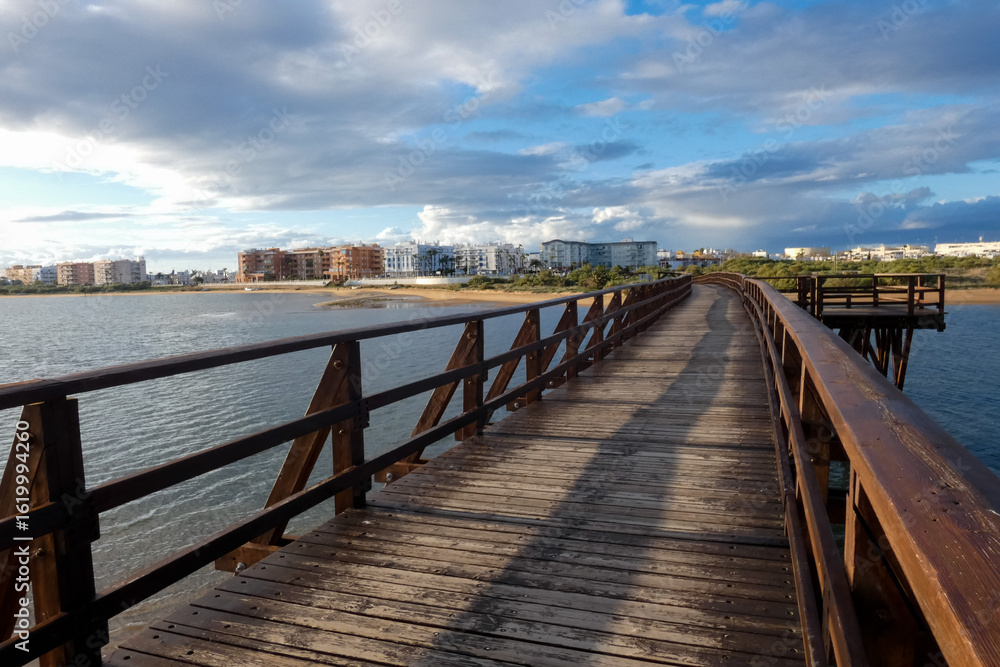 Fototapeta premium Wooden footbridge crossing In Huelva, Isla Cristina, Spain