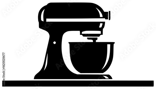 Mixer in the kitchen on the table with big bowl working with dough and spoon in storage cabinet with long cord near oven in the corner