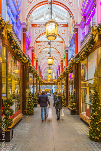Christmas decorations and shoppers in The Royal Arcade, Mayfair, London, England