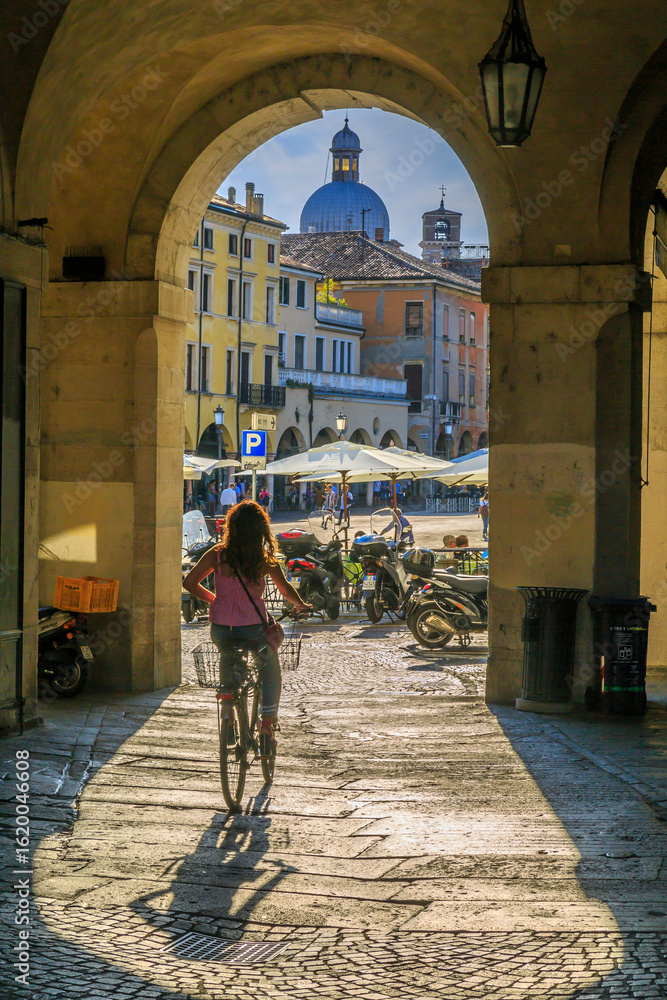 custom made wallpaper toronto digitalView of cyclist and Piazza delle Erbe through archways and dome of Padua Catherdal visible, Padua, Veneto, Italy