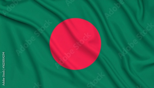 Bangladeshi national flag with red circle on a green field, symbolizing bloodshed and lush land, shown in gentle daylight