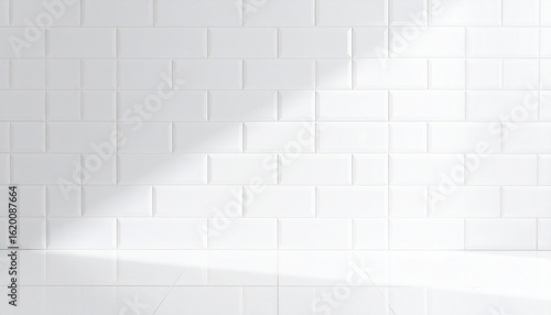 Clean white brick tile wall background with sunlight and shadow. Modern minimalist bathroom or kitchen backdrop for product presentation.