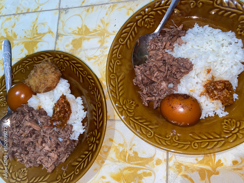 Gudeg or young jackfruit cooked for a long time with a lot of spices and brown sugar. Gudeg young jackfruit and eggs. Indonesian food. Gudeg tastes sweet.