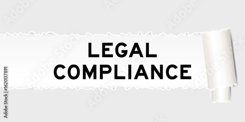 Ripped gray paper background that have word legal compliance under torn part