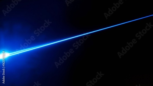 A blue laser beam with an intense diffused light source on the left side against a completely black background