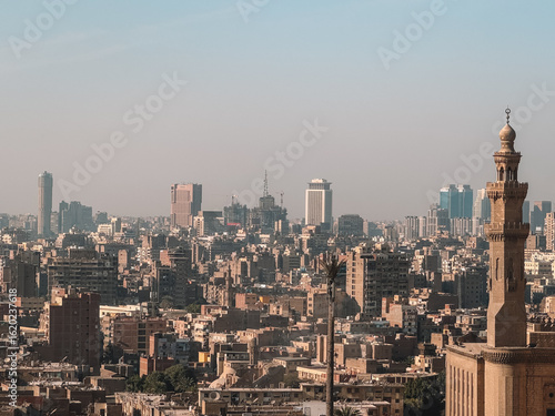 Cairo skyline at noon with haze and warm tones
