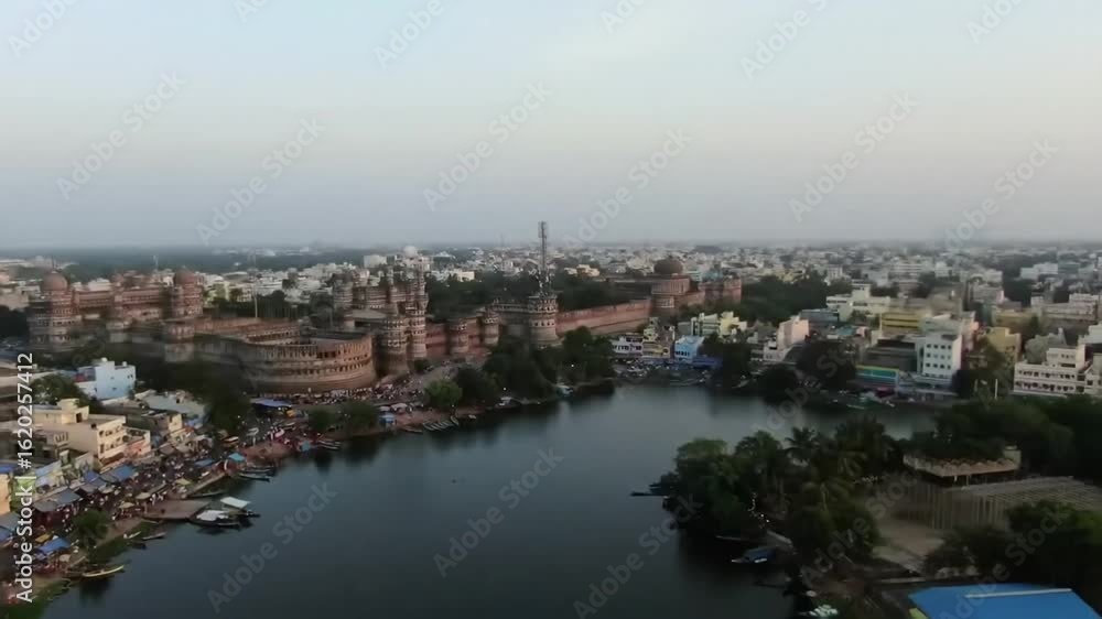 An aerial view showcases a bustling cityscape with ornate buildings, busy streets, and a cloudy sky, depicting urban life. An aerial view showcases a bustling cityscape with ornate buildings, busy streets, and a cloudy sky, depicting urban life.