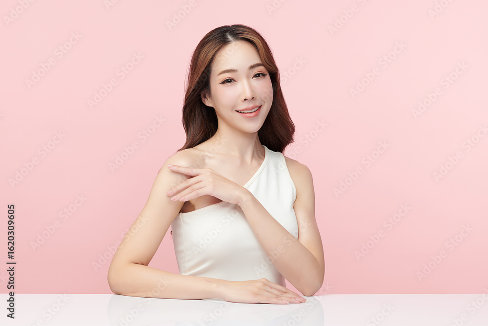 A beautiful young Asian woman with clean, fresh skin against a pink background. Skincare, facial treatment, cosmetology, beauty, and spa. An elegant portrait of an Asian woman. A beautiful young Asian woman with clean, fresh skin against a pink background. Skincare, facial treatment, cosmetology, beauty, and spa. An elegant portrait of an Asian woman.