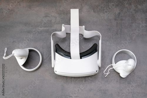 White 3D virtual reality glasses. VR glasses and helmet. Top view. An interactive high-tech game. Playing a virtual game.