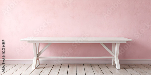 Whitewashed table staged with a pink wall for a fresh cottage-inspired and minimalist setup