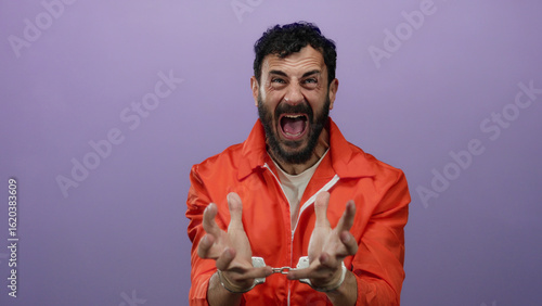 Hispanic man in prison jumpsuit passionately gestures in handcuffs against a purple backdrop, emphasizing incarceration emotion and justice themes.