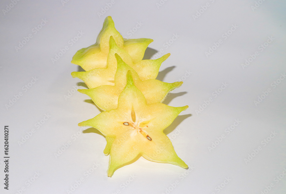 Fototapeta premium yellow sliced belimbing or star fruit 