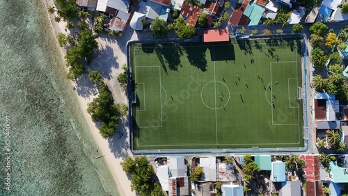 Fototapeta Naklejka Na Ścianę i Meble -  Aerial Paradise in the Maldives – Crystal Clear Water, Islands & football field