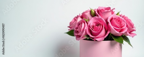Elegant pink flower bouquet in gift box, white background, birthday, love, close up