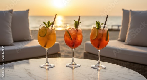 Refreshing Summer Cocktails Served on a Beachside Table at Sunset with Ocean Views