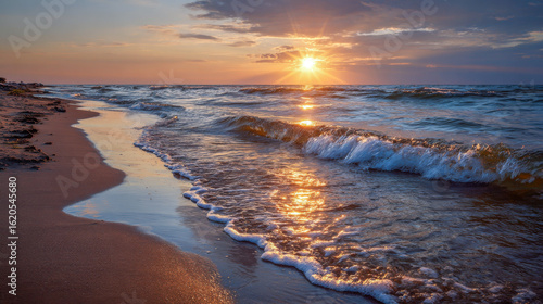 Wallpaper Mural Soft waves caress the sandy beach as a breathtaking golden sunset paints the sky. Warm reflections shimmer on the wet sand, creating a serene coastal atmosphere at dusk Torontodigital.ca