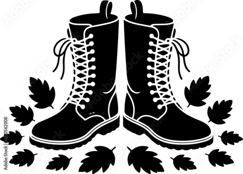 black silhouette vector of a pair of boots standing amidst scattered autumn leaves