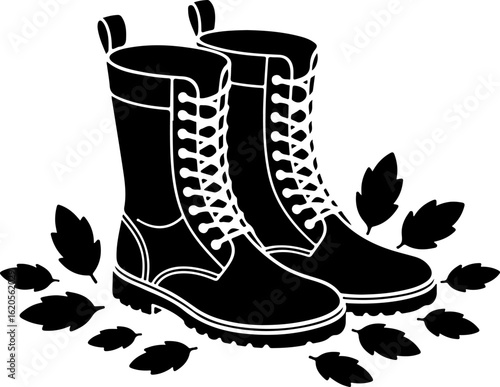 black silhouette vector of a pair of boots standing amidst scattered autumn leaves