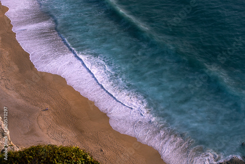 The closeup of a crashing  wave on Nazare beach