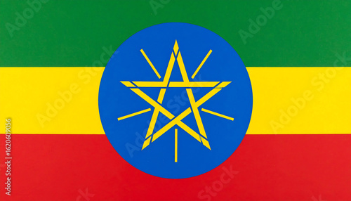 Ethiopian tricolor flag—green-yellow-red stripes with blue disc and radiant yellow star