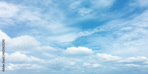 Cloudy blue summer storm  in the sky, watercolor background, horizontal view, beautiful cloudscape, fresh air, nature shining light, sunrise sky, panoramic view, daylight, vast fluffy tiny white sunsh