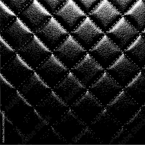 Close up of a black leather quilted pattern with visible stitching and diamond shaped padded sections texture