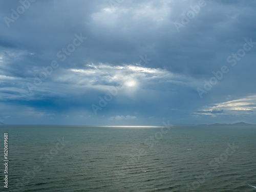 Seascape with strong wind and wave under cloudy sky in evening